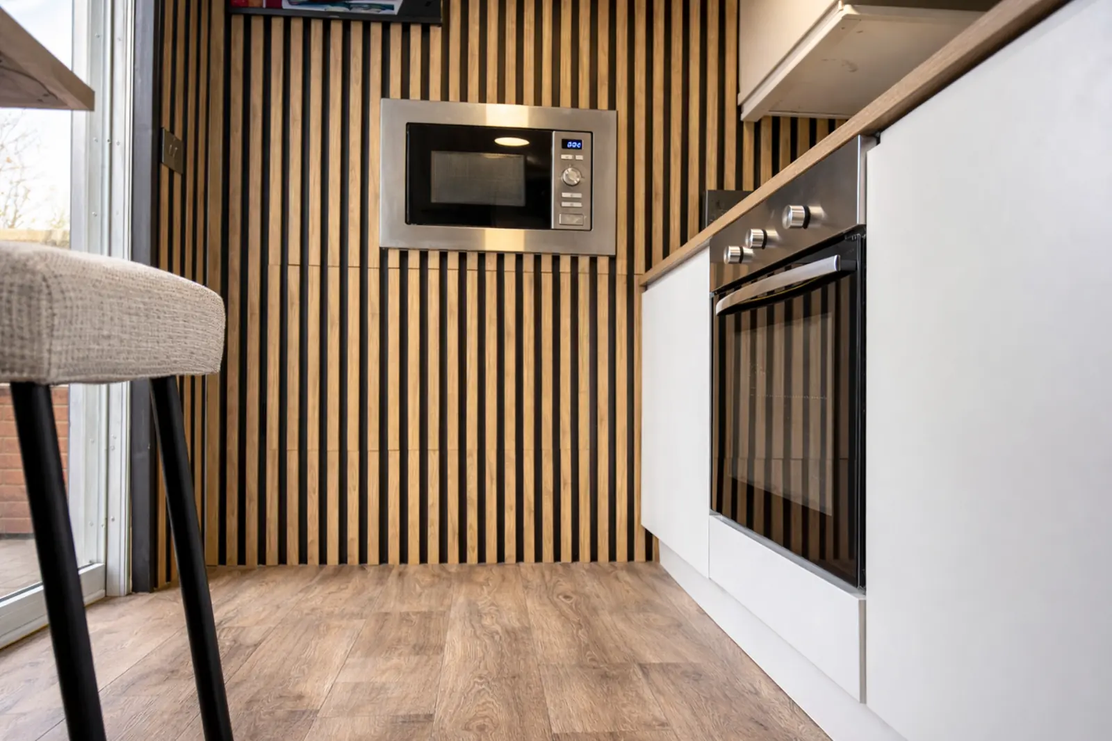Kitchen pod interior — built-in microwave and oven